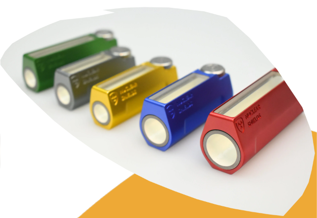 Five cylindrical rectangular batteries in green, gray, yellow, blue, and red, arranged diagonally on a white background with a curved orange accent shape.
